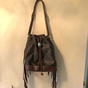 Purse no longer has fringe! Braided sides.